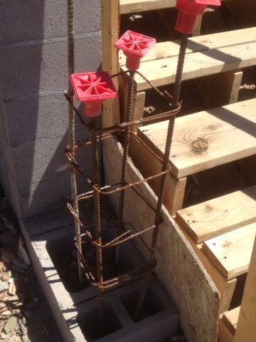 The rebar that will be part of entry wall and gate system looks like flowers in a vase.