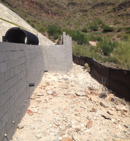 Front retaining walls are finished and on a steep grade.