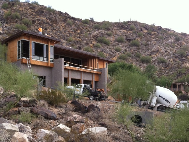Concrete is needed around the back of the house which has limited space for the large truck to maneuver.