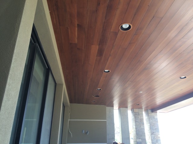 A gorgeous wood ceiling runs seamlessly from the inside to the outside of the home making the homeowners comfortable and relaxed whether inside or outside.