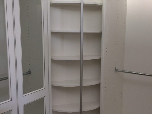 Rounded shelving on two of four sides of this unit.