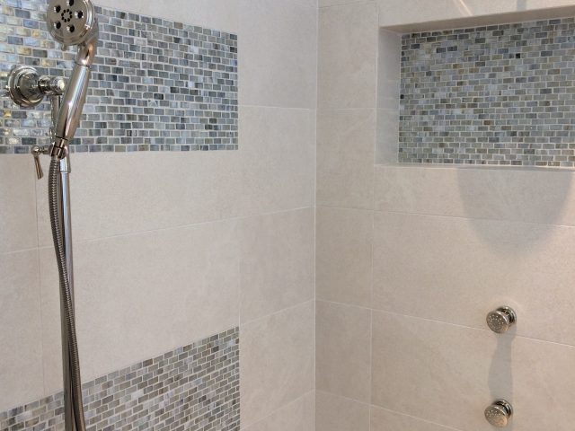 Beautiful tilework and multiple shower heads in Master Shower for the ultimate relaxation experience.